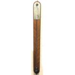 A mahogany stick barometer with ebony bordered rectangular rounded panel, having dial signed W