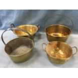 A group of four brass jam pans, three with iron handles. (4)