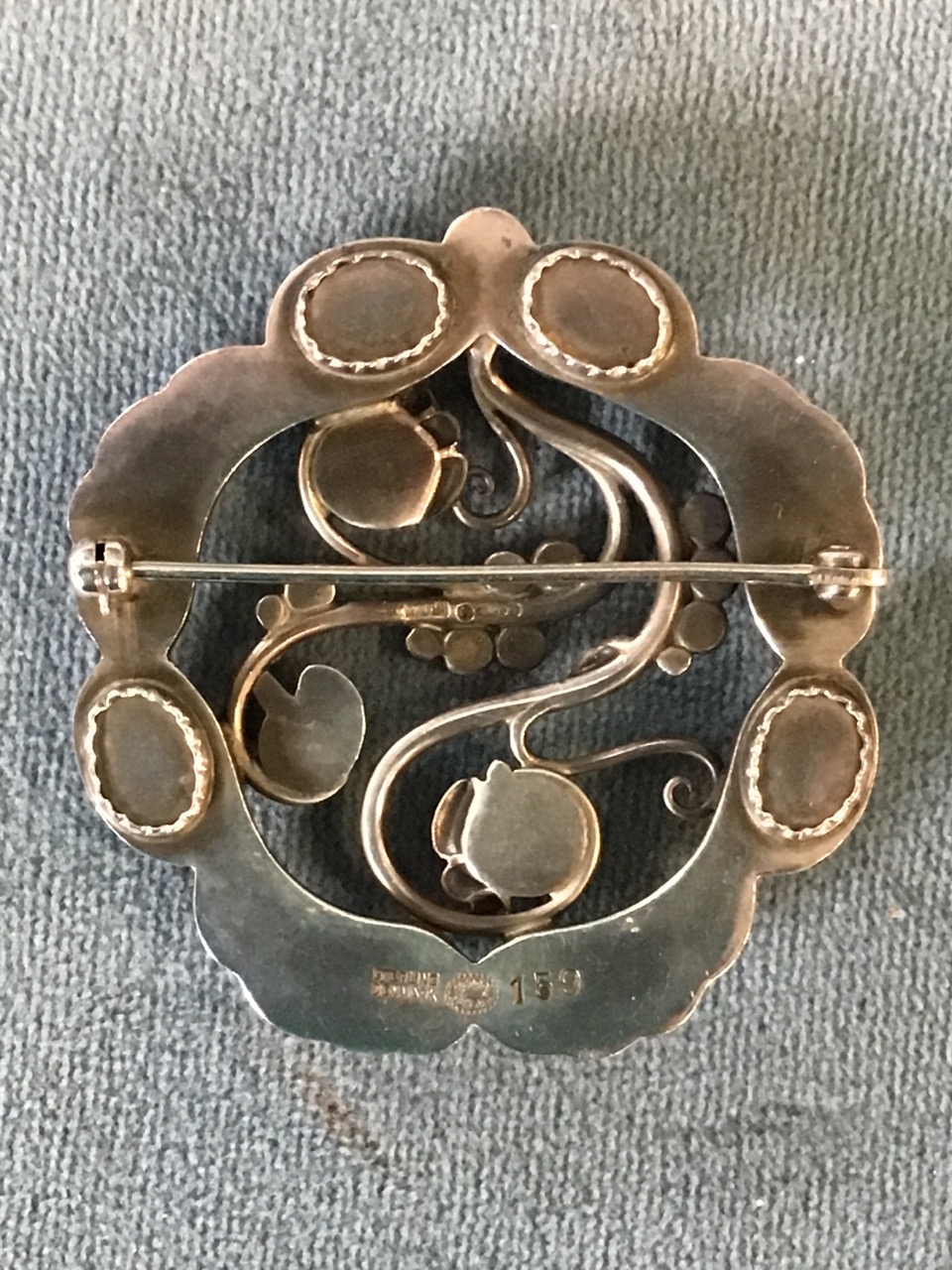 A circular Georg Jensen hallmarked silver brooch of pierced naturalistic form mounted with - Image 2 of 3