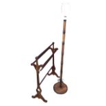 A Victorian mahogany towel stand with pierced shaped supports on scrolled feet supporting five