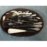 A collection of silver, mother-of-pearl, bone and ebony mounted steel button hooks, awls and crochet