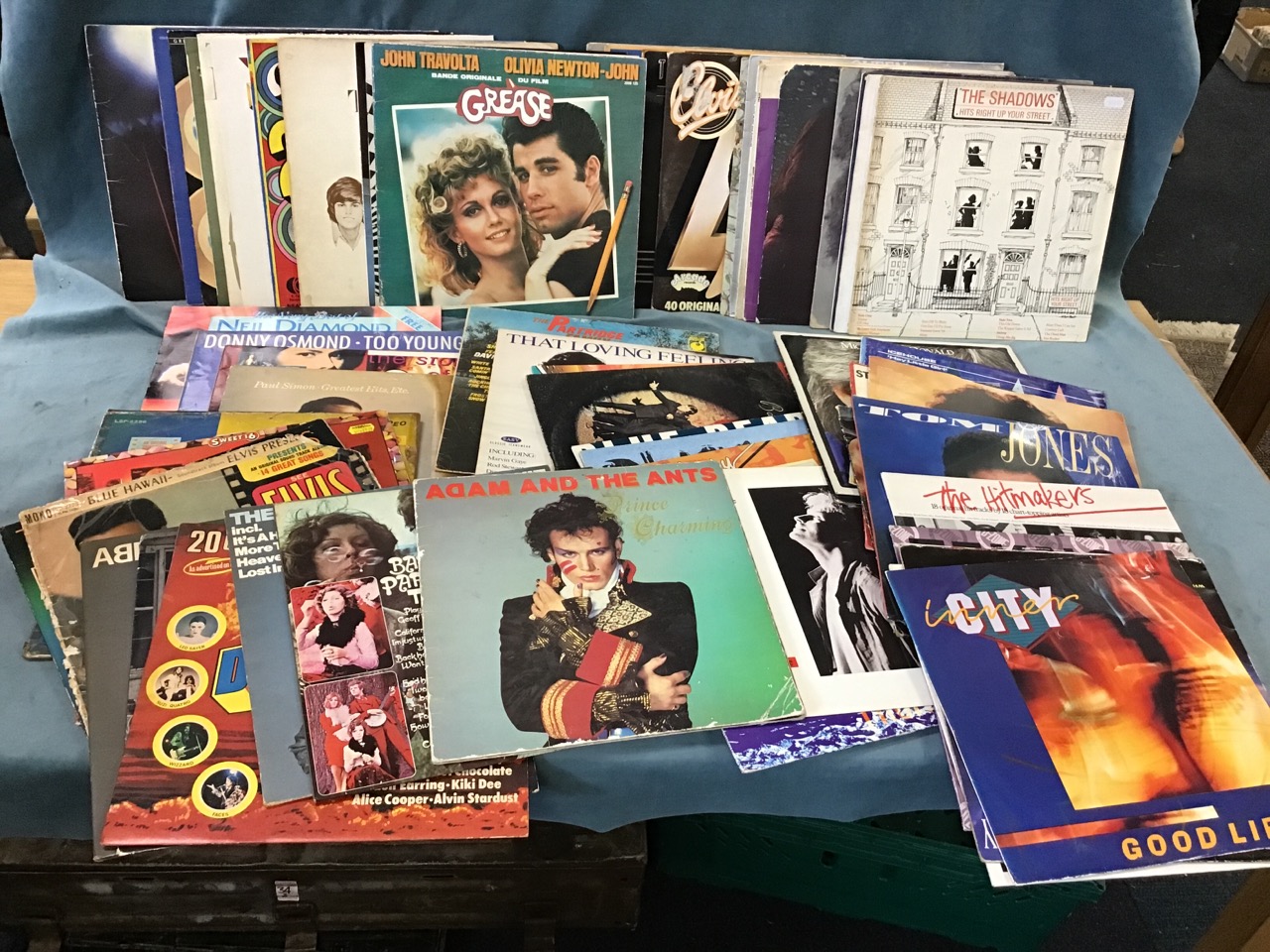 A box of vinyl LPs - mainly pop, Adam Ant, Buddy Holly, collections, Queen, Dubliners, Shadows, an