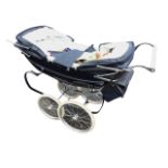 A Silver Cross traditional double-ended perambulator with rain hoods and coachlined black body on