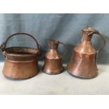 Two bell shaped antique hand-beaten copper jugs riveted with iron handles, one with hinged cover;