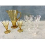 A set of six lead crystal conical wine glasses with teardrop hollows to columns on circular