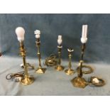 Five Edwardian brass table lamps - a pair with baluster columns with pleated silk shades, hexagonal,