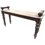 A Victorian oak window seat, the rectangular moulded bench with roller handles, raised on turned