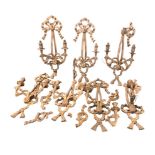A set of seven carved wood wall sconces, the wallplates with ribbon bows supporting festoon drapes