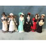 A collection of six standing costume dolls with porcelain heads and arms, the girls in traditional