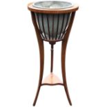 A Victorian mahogany jardiniere stand with zinc liner to circular basket inlaid with chequered