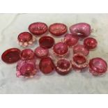 A collection of Victorian cranberry glass bowls and small dishes, scalloped, heart shaped fluted,