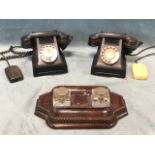 Two black bakelite telephones with a Berwick number, serial D62099 FDI batch No 14; together with