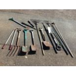 Miscellaneous garden tools - spades, rakes, a fork, hoes, choppers, etc. (12)