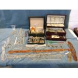 A quantity of jewellery including bangles, earrings, necklaces, beads, two leather boxes with trays,
