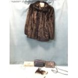 A ladies black fur jacket by Grosvenor/Harrods; and three ladies clutch bags - leather, Bulaggi,