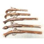 Five replica flintlock pistols with hardwood stocks, some with brass mounts, some with engraved
