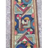 A deco runner, woven hooky-style with coloured abstract geometric panels between brown lines. (253.