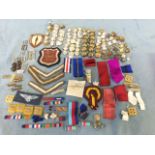 A box of military buttons, badges, pips, medal ribbons, buckles, etc. (A lot)
