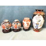 A Japanese brick-red and gilt decorated Arita Kakiemon style vase and cover with continuous