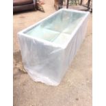 An unused rectangular insulated garden trough with liner. (47in x 20in x 20in)