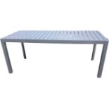 A rectangular powder coated metal garden dining table, the slatted top raised on triangular column