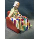 A Royal Doulton figurine titled The Patchwork Quilt with lady seated on armchair sewing - printed