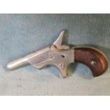 A miniature Derringer pocket pistol with mahogany handle - chrome finish & stamped DP. (3.25in)