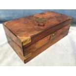 A Victorian walnut travelling desk, with brass military mounts and escutcheon opening to apertures