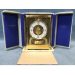 A boxed 20th century Swiss Atmos mantle clock by Jaeger-LeCoultre, the mechanism in a glass case and