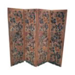 A four-fold crewelwork upholstered screen, each rectangular panel with floral and foliate wool