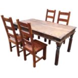 An Rajasthan style dining table, the heavy plank top with large iron nailheads above an apron with