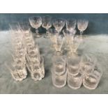 A collection of C19th and later glasses including 12 large slice-cut tumblers, 4 conical wine