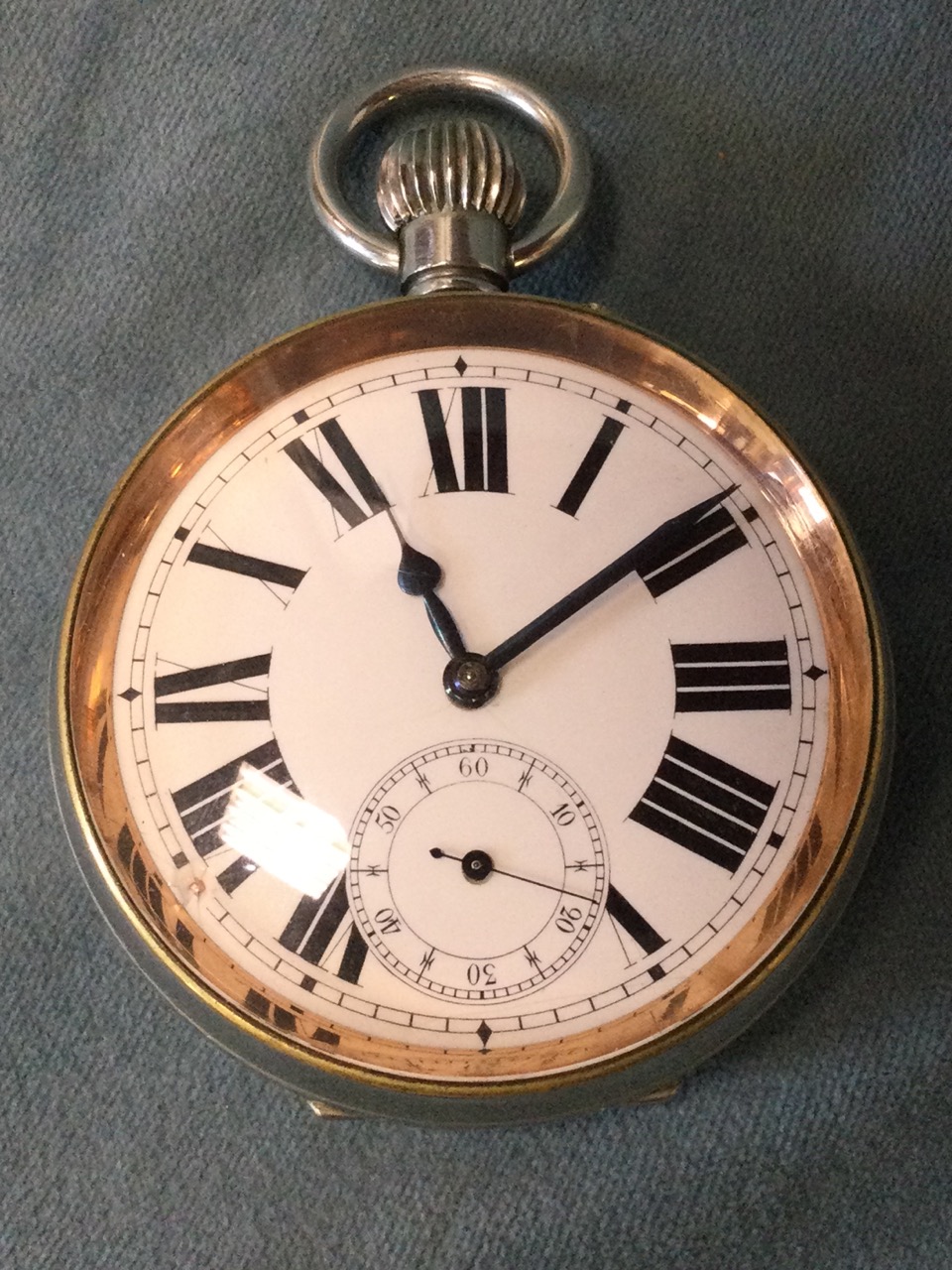 A giant silver plated pocket watch with roman chapters to enamelled dial under bevelled glass, in - Image 2 of 3