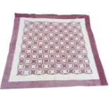 A Victorian patchwork interlocking wedding ring pattern quilt, in plum and white floral and abstract