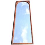 A late Victorian rectangular walnut framed mirror with arched moulded frame to plate, the corner