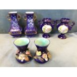 A pair of continental square tapering blue & gilt floral decorated scroll handled vases; an urn