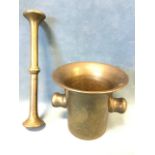 An ancient heavy bronze mortar & pestle, the flared vessel with lugs, the grinder of batten form. (