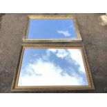 Two contemporary foliate gilt-framed mirrors, the smaller with bevelled plate. (39.5in x 28in & 40in