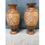 A pair of Doulton Slater stoneware vases of ovoid form embossed with floral enamelled decoration