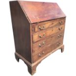 A George III mahogany bureau, the cleated fallfront on lopers enclosing an interior with pigeonholes