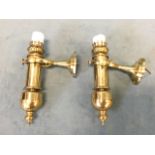 A pair of gimbal mounted brass wall-lights with faux oil lamps, on circular wall brackets. (10in) (