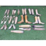 A quantity of hardwood hunting boot trees, some pairs, some with brass mounts, some Victorian,