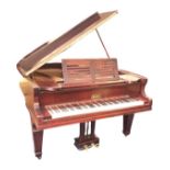 A mahogany cased Maass baby grand piano, the instrument with a seven octave keyboard, raised on