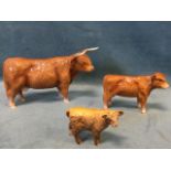 A set of two Beswick highland cattle figurines - a horned mother and her calf, printed John Beswick;
