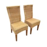 A pair of cane conservatory chairs, with tapering panelled backs above seats with arched aprons,