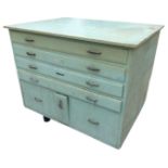 A painted plan chest with four long drawers above a central drop-down compartment framed by larger