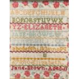 A colourful Victorian sampler sewn by Elizabeth Jane Brown of Ferryhill aged 11, with alphabet and