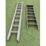 An extending wood two-section ladder with 18 rungs; and a wood stepladder with 7 treads. (95in and