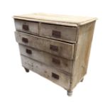 A Victorian pine chest of drawers, with rectangular rounded top above two short and three long