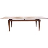 A rectangular mid-century G-Plan teak coffee table with cleated top on rectangular tapering legs. (
